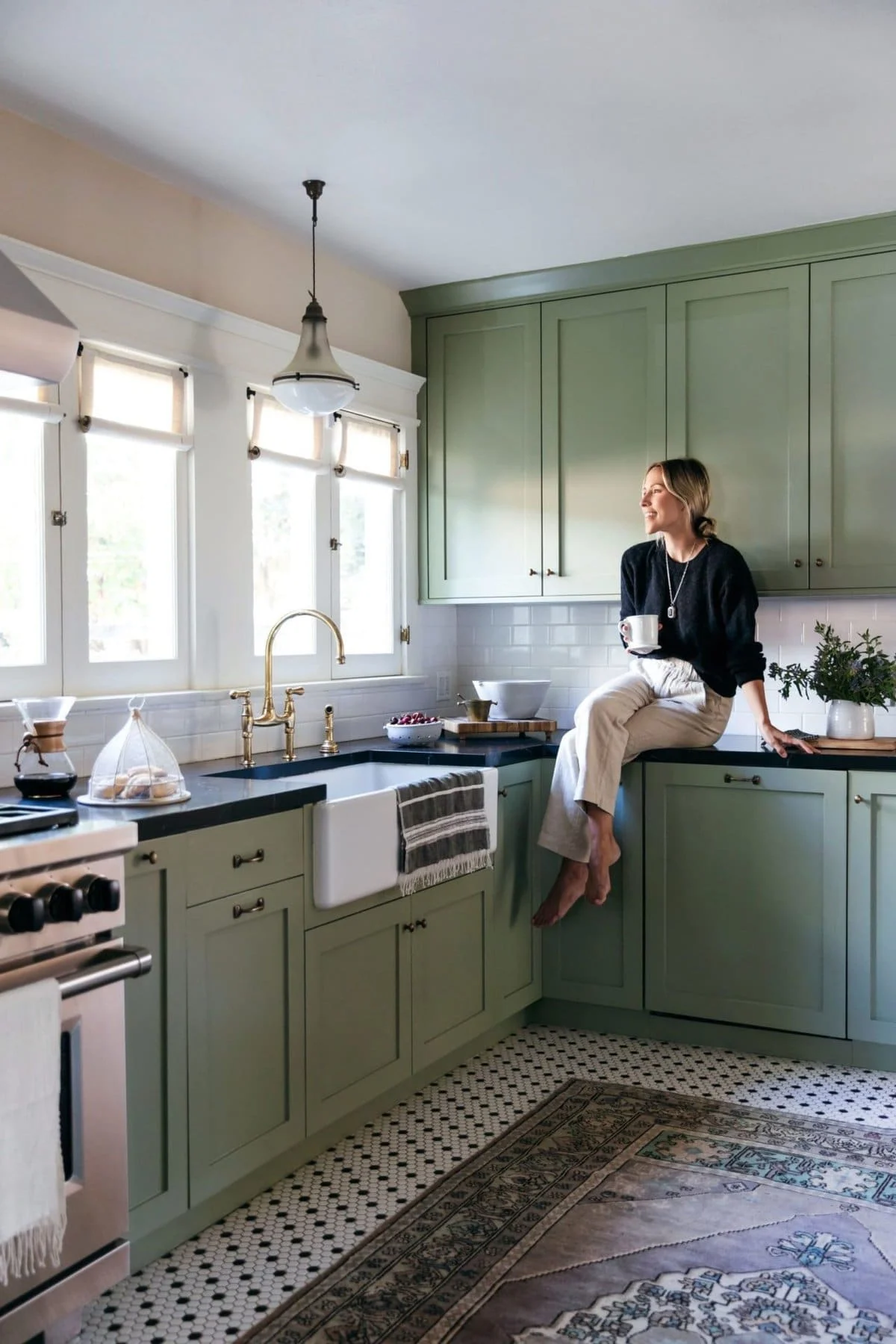 Sage green kitchen cabinets with coordinated paint colors