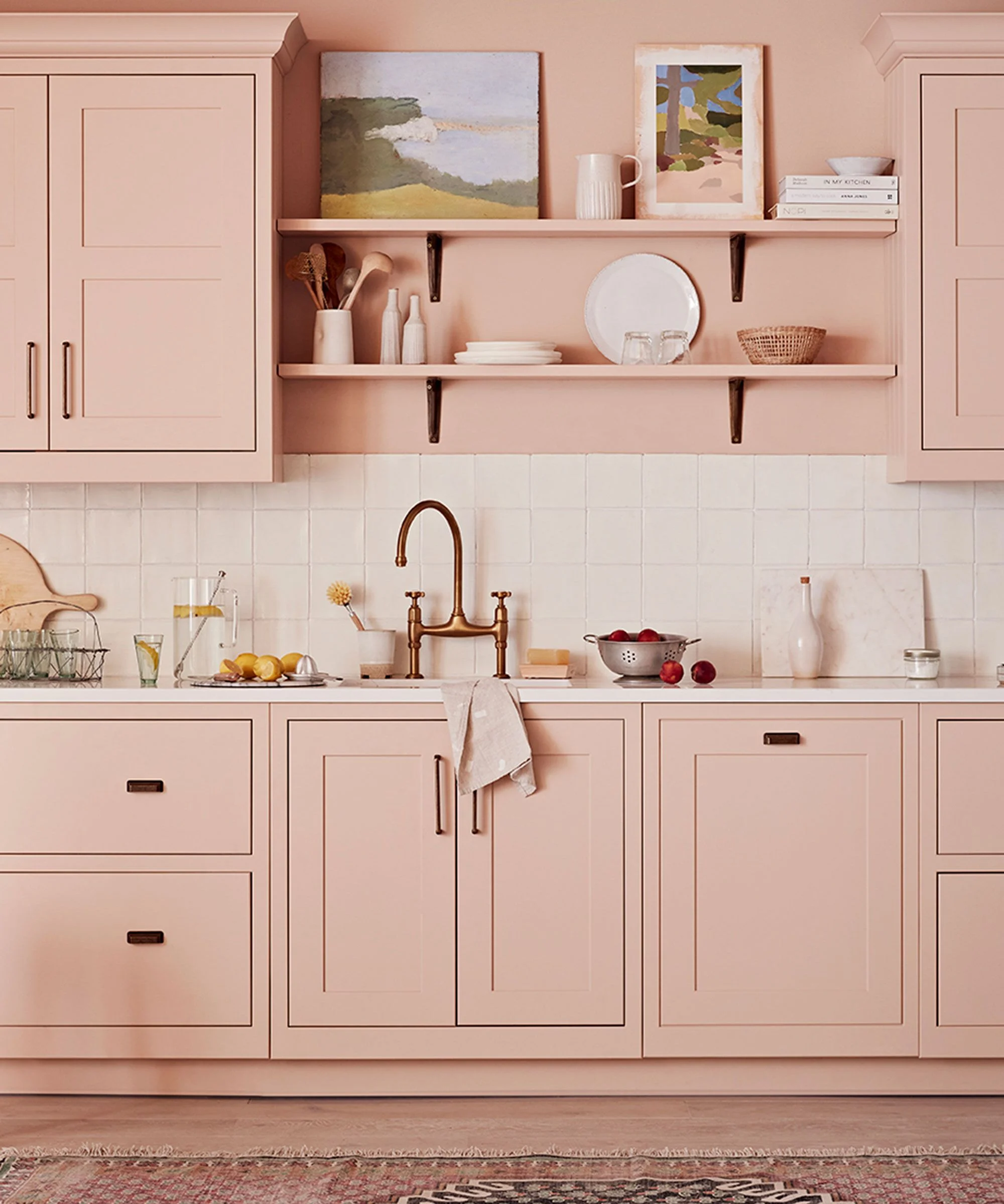 Terracotta pink shaker kitchen with open wood shelves and patterned runner