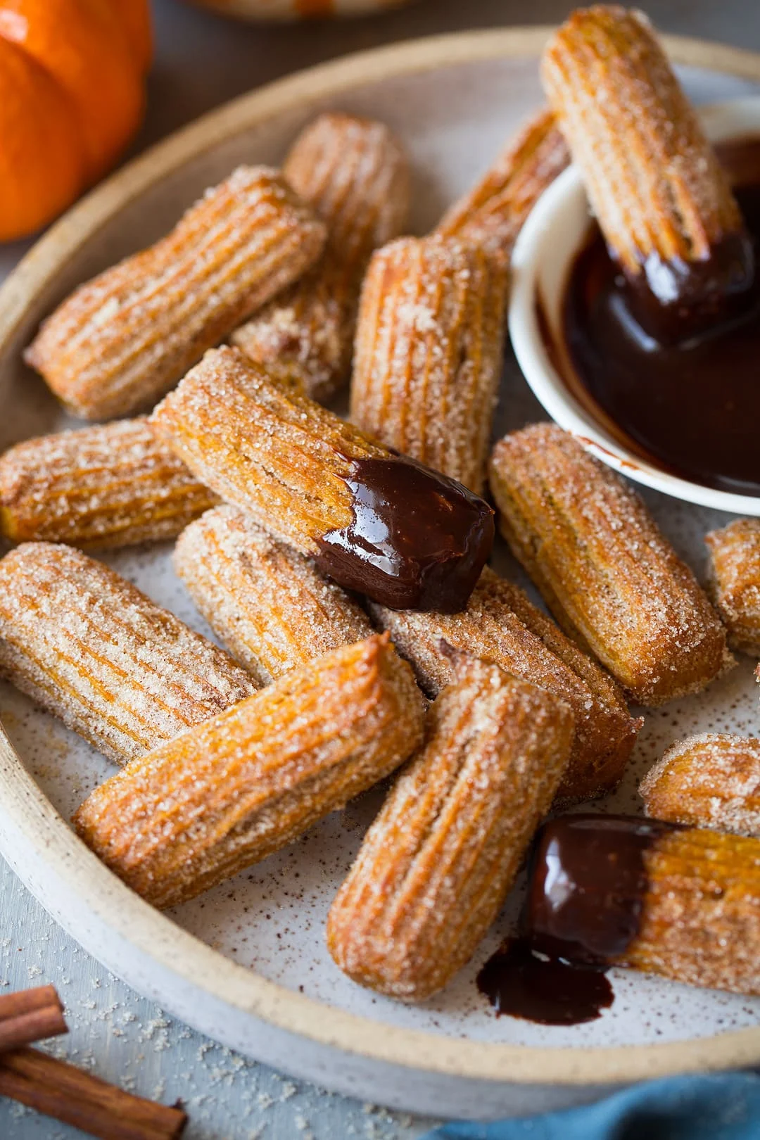 Pumpkin churros with warm cinnamon-sugar and chocolate sauce