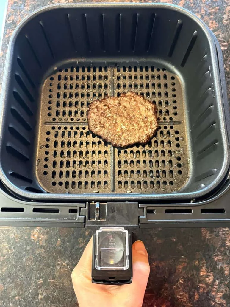 Stack of double air fryer smash burgers with crispy lacy edges and melted cheese