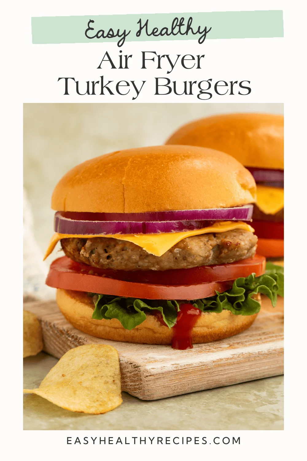 Air fryer turkey burger on whole wheat bun with avocado, lettuce, and tomato